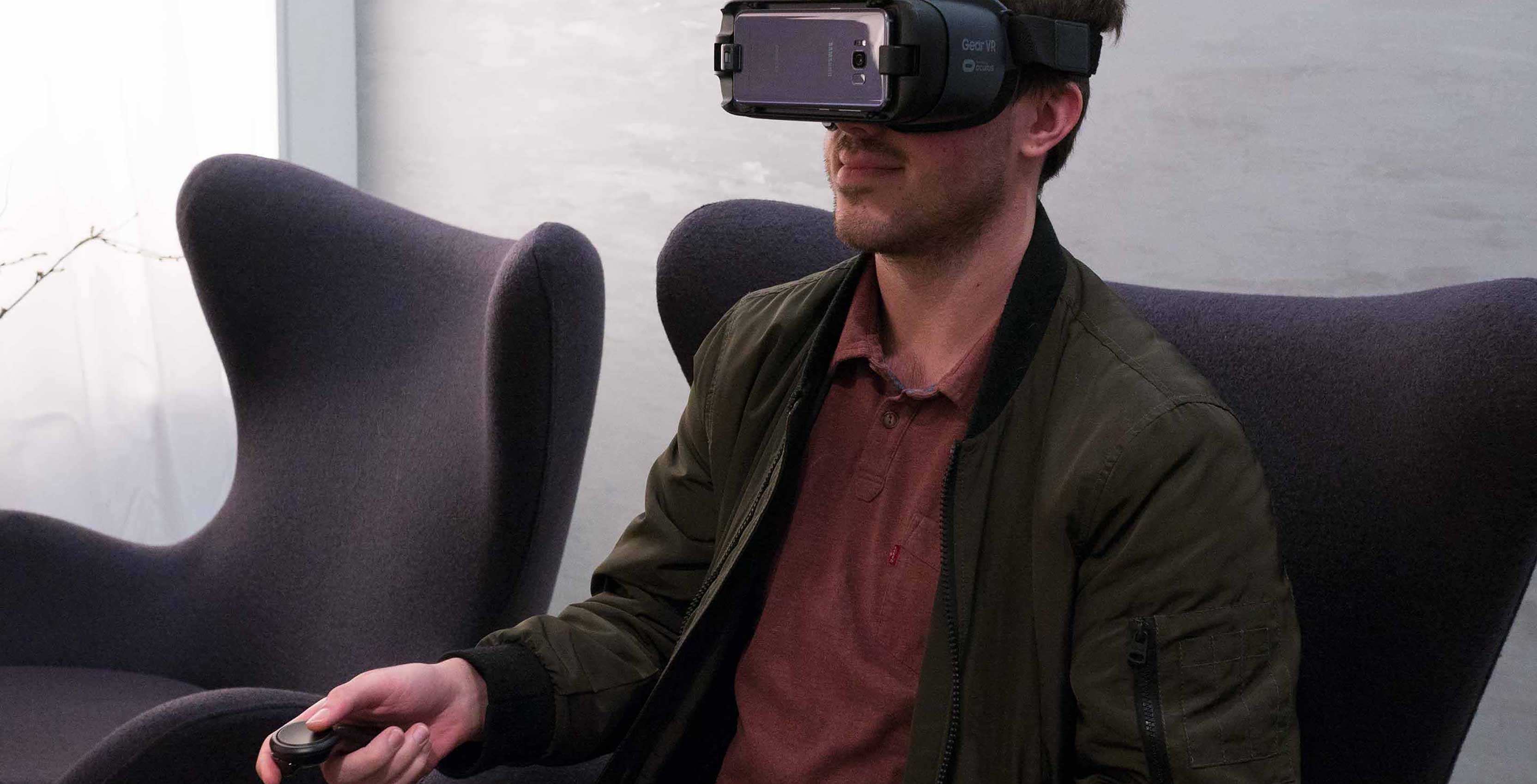 Man with VR headset watching content