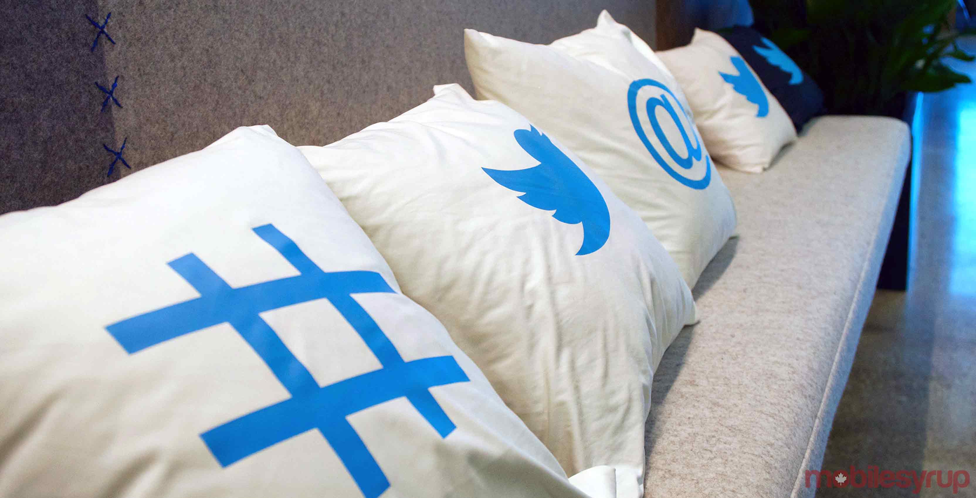 A collection of pillows featuring popular Twitter icons
