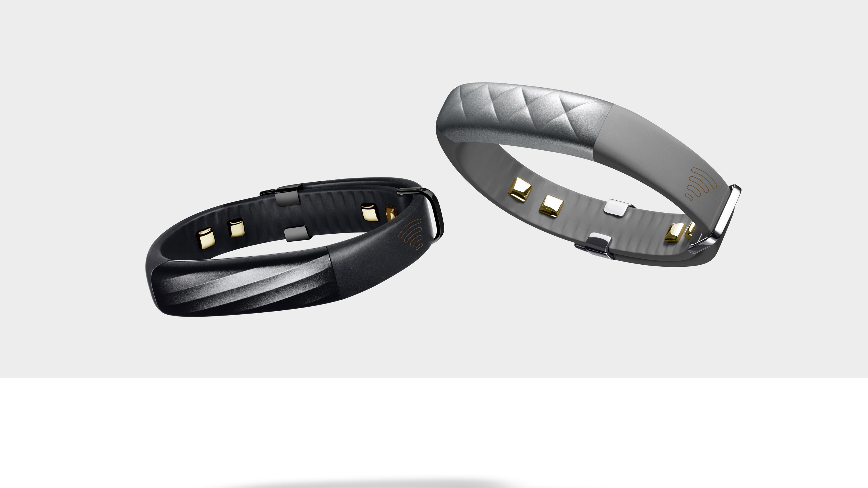 Jawbone black and silver fitness trackers