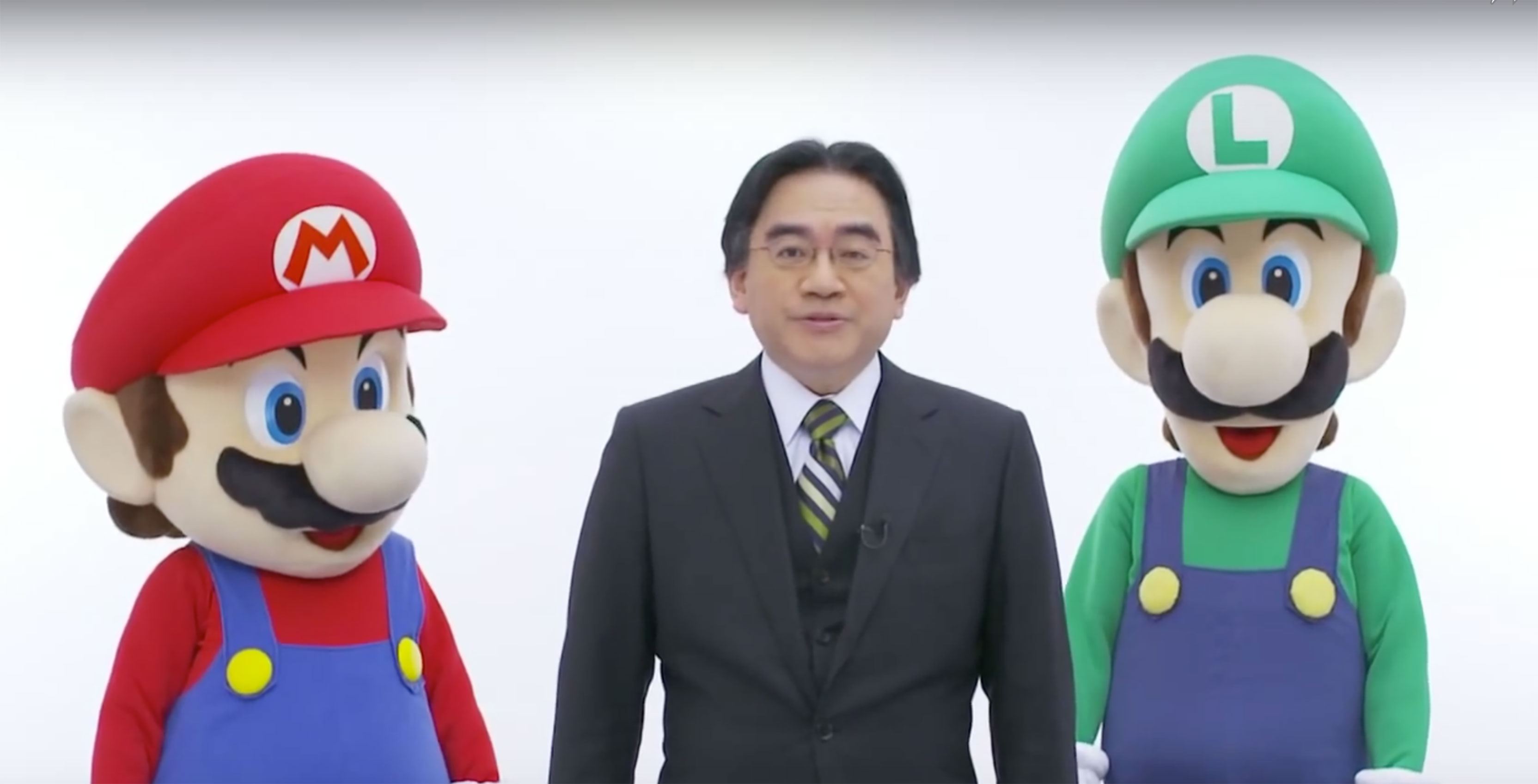 Satoru Iwata with Mario and Luigi