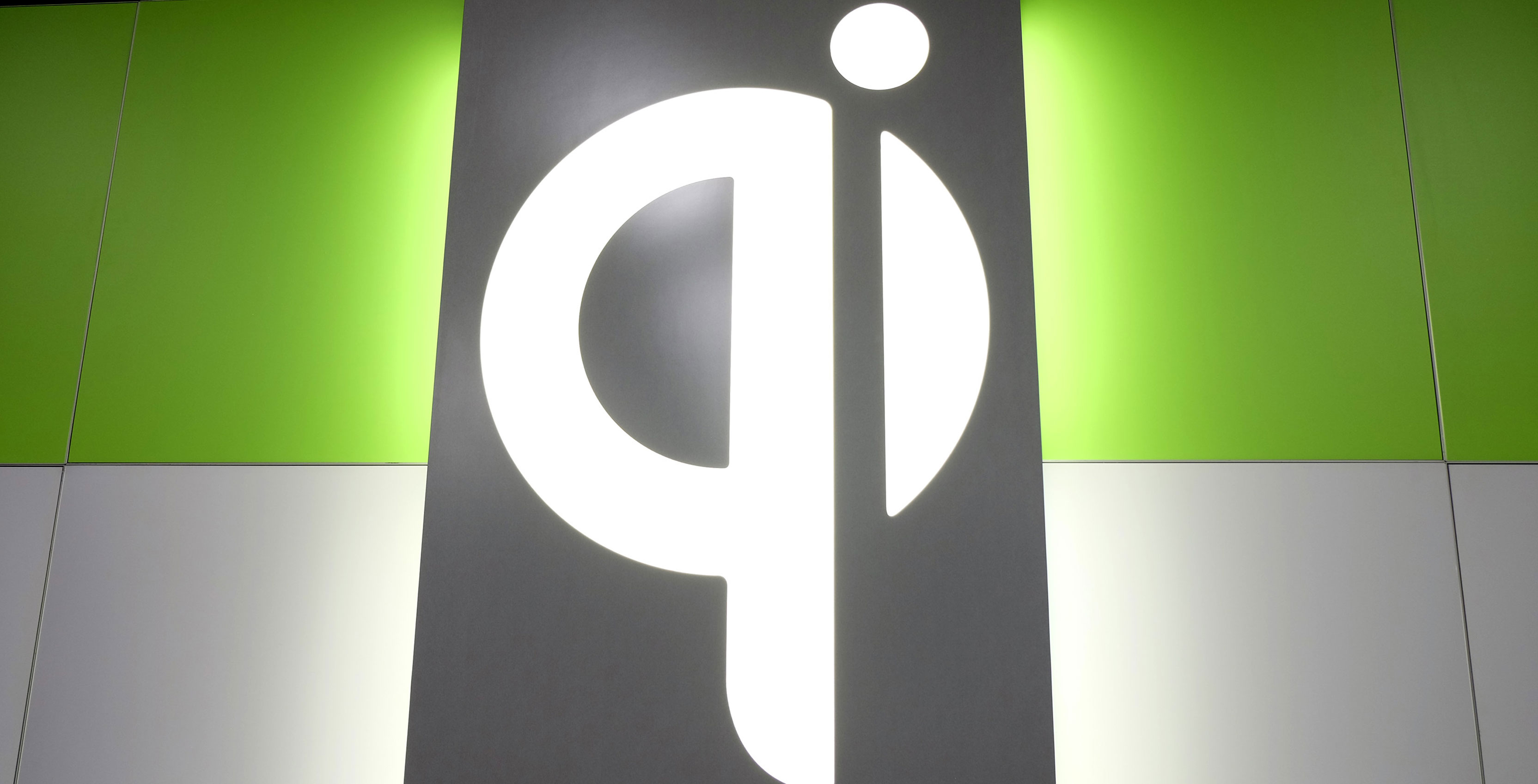 QI logo on wall at CES 2018