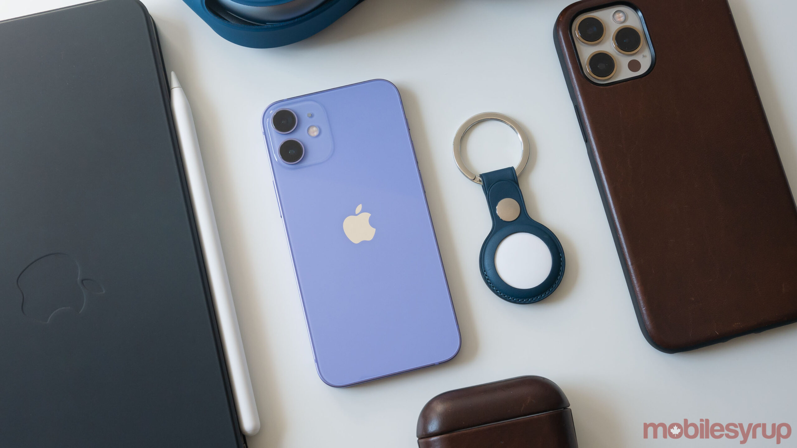 Purple iPhone 12 and AirTag