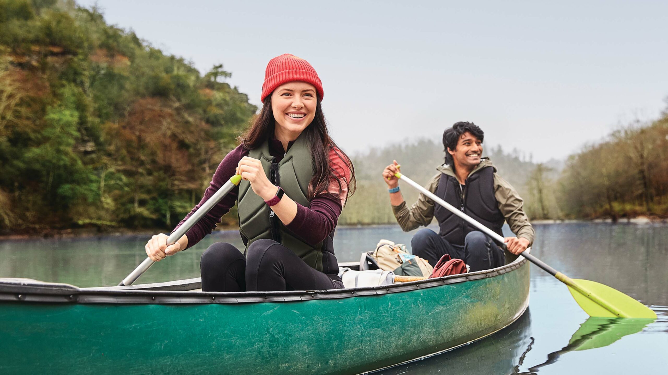 Person in canoe wearing Fitbit Charge 5
