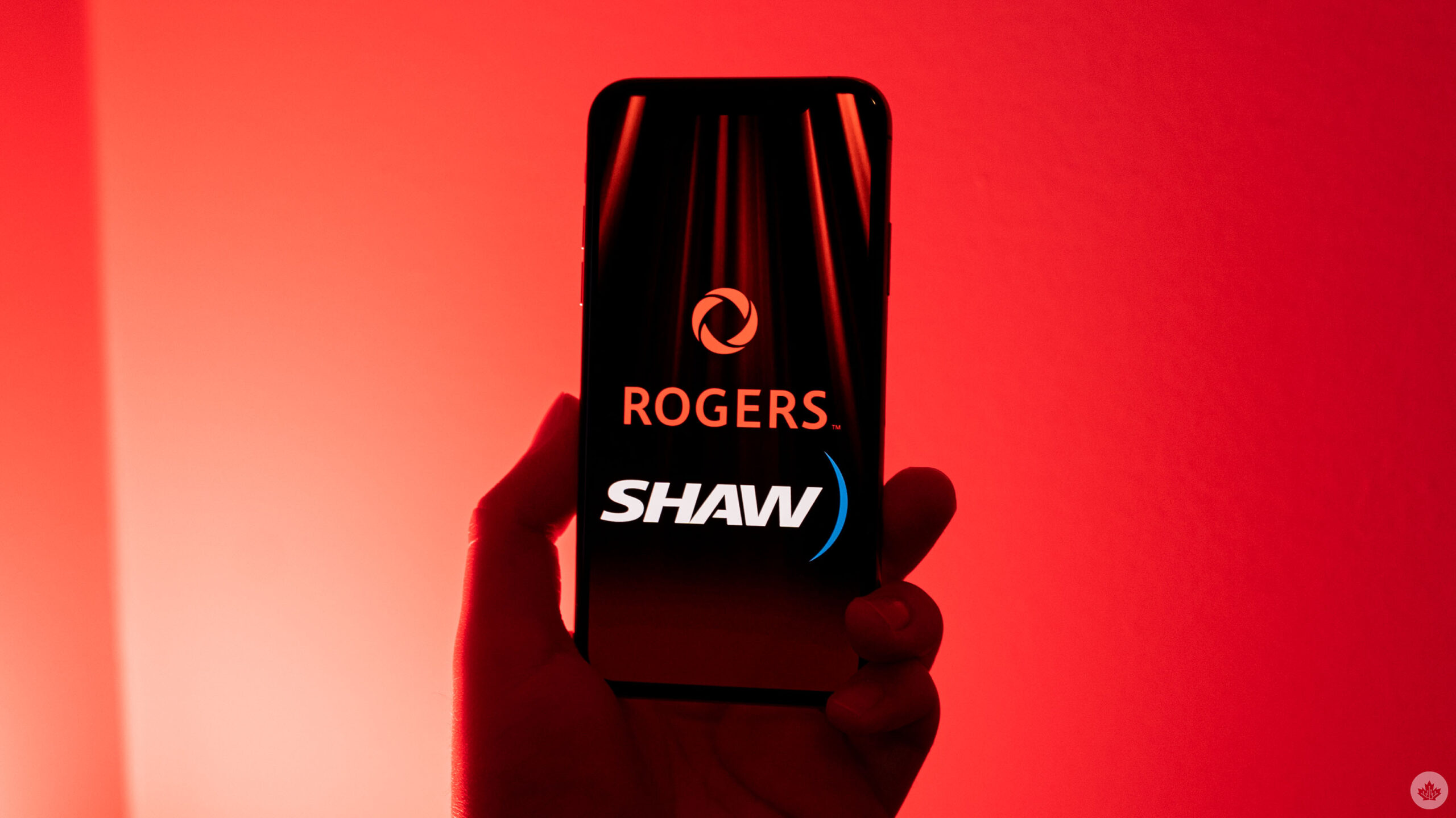 Rogers and Shaw logos on an iPhone