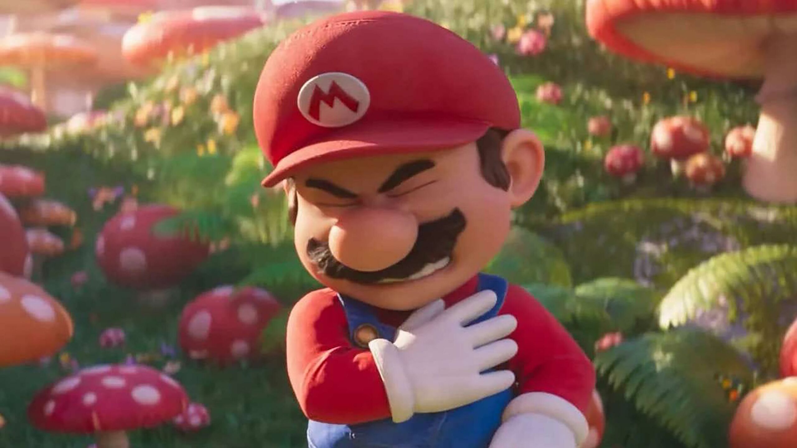 Mario clutching his chest in pain in The Super Mario Bros. Movie